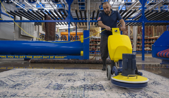 Professional rug cleaning service using a machine